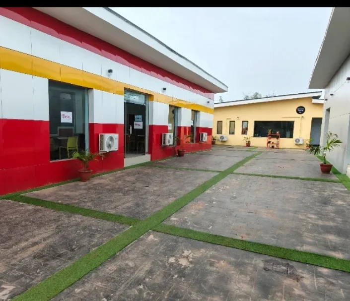 The Nourish counter at Blinkx — the red, white and yellow building across the courtyard