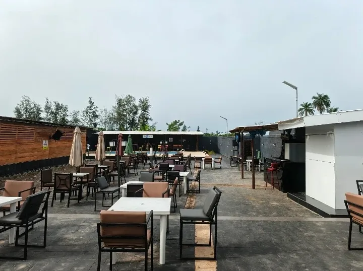 The Blinkx poolside terrace, tables set out around the pool