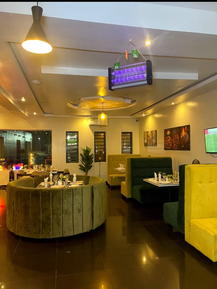 The Blinkx dining room, velvet booths and set tables