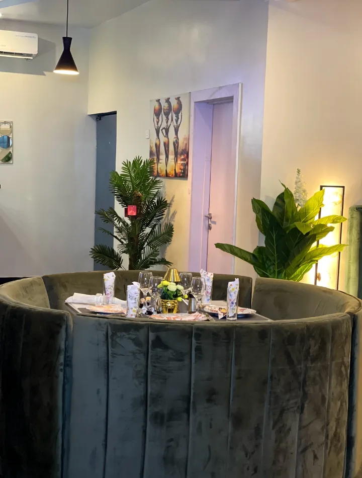 The round velvet booth, table set for a group